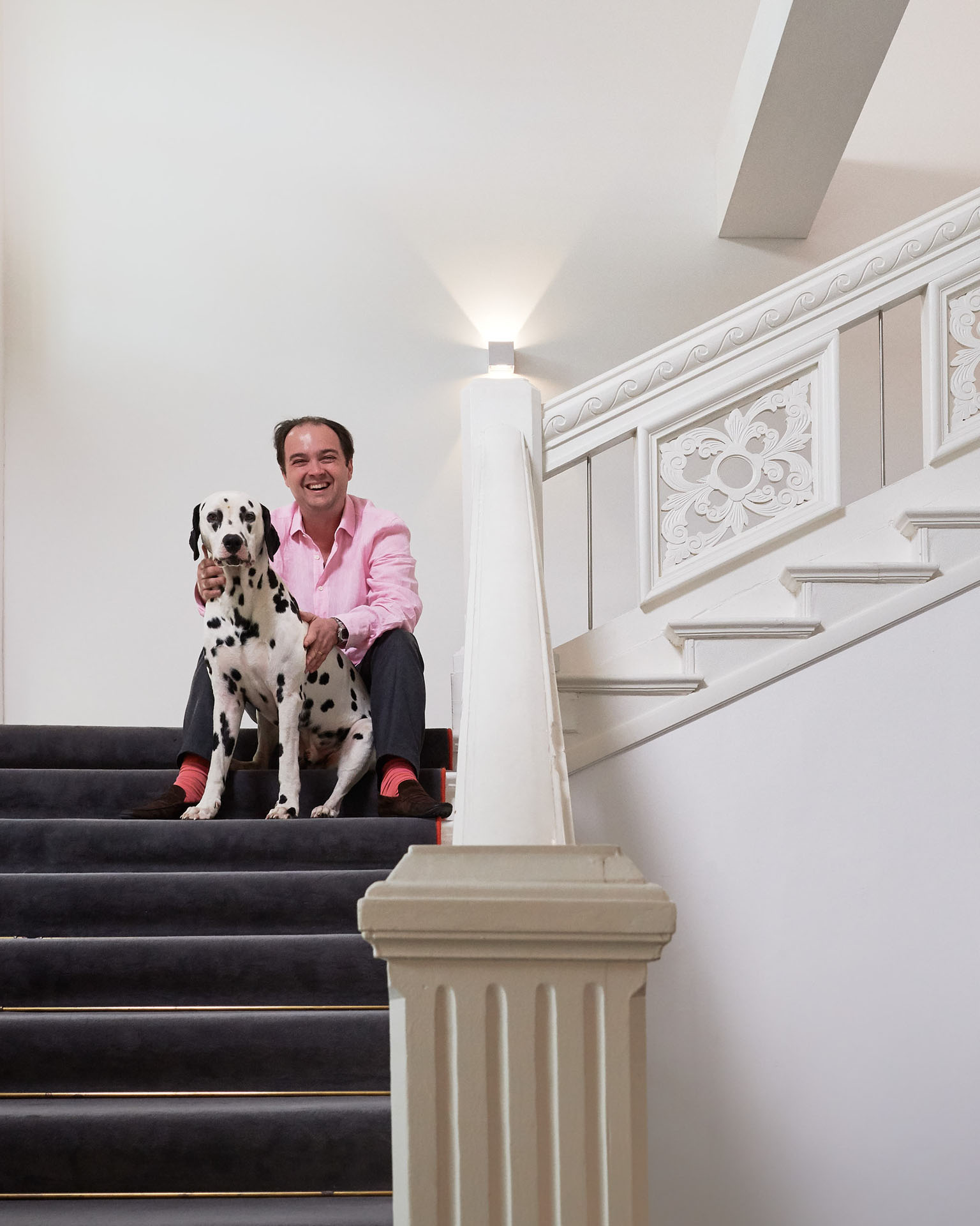 Till Richter with his Dalmatian on a staircase in Buggenhagen Castle